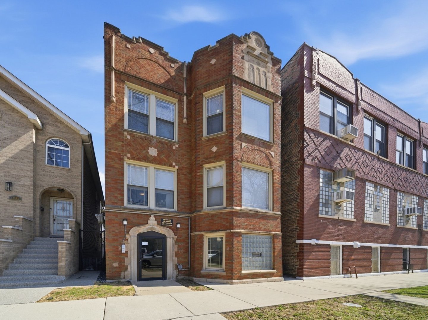 1253 South Tripp Avenue Chicago, IL 60623 - Photo 1 of 21 a front view of a multi story building