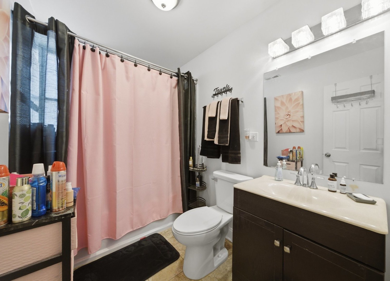 1253 South Tripp Avenue Chicago, IL 60623 - Photo 16 of 21 a bathroom with a sink vanity mirror and toilet