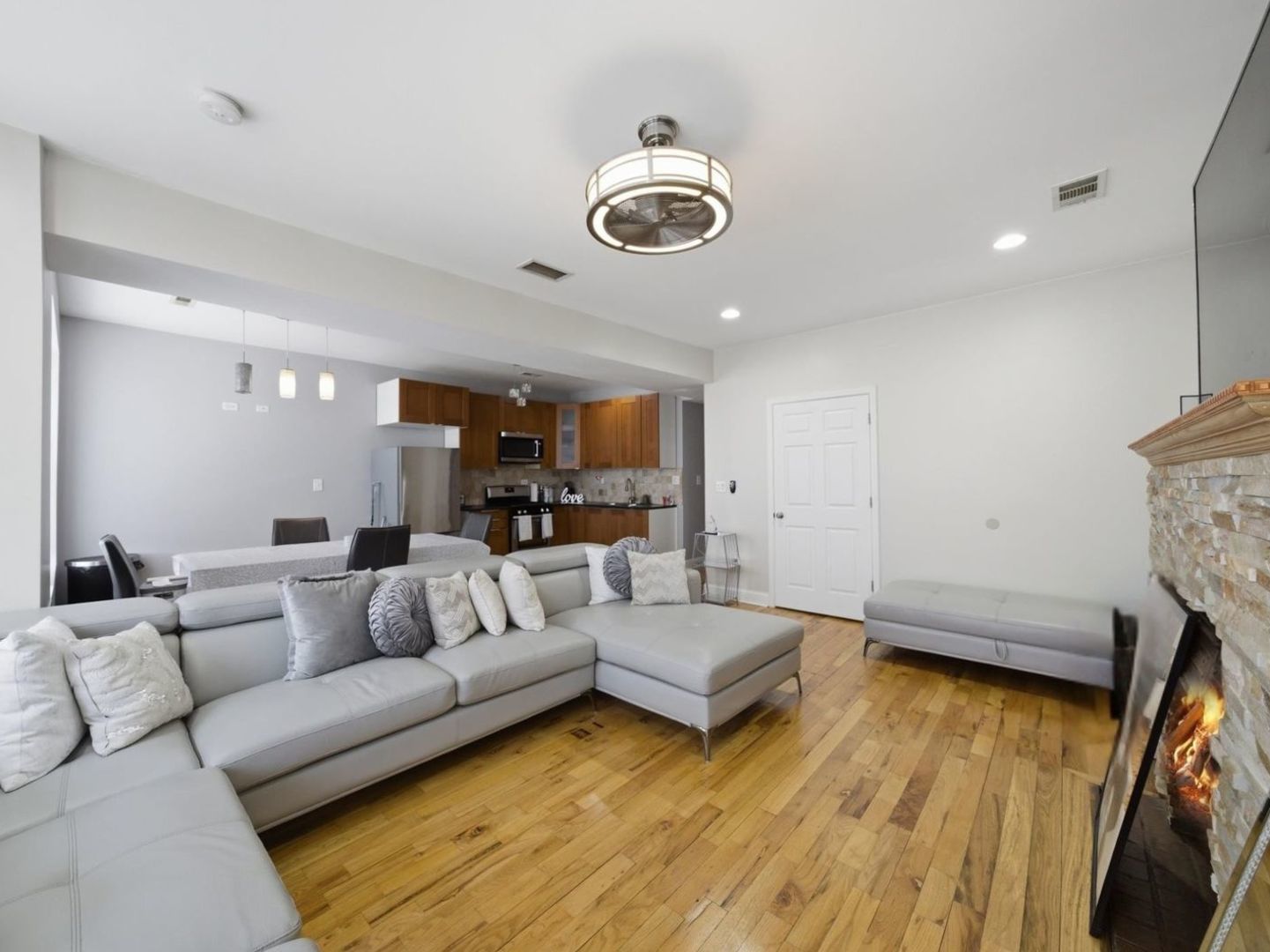 1253 South Tripp Avenue Chicago, IL 60623 - Photo 2 of 21 a living room with furniture and a wooden floor