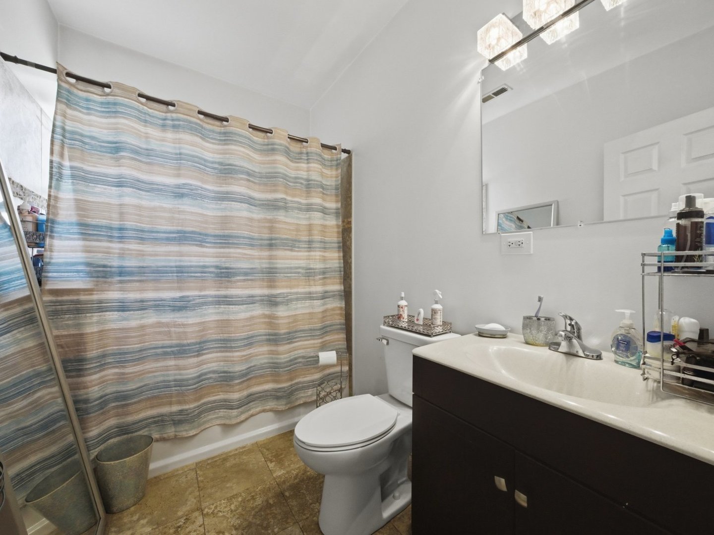 1253 South Tripp Avenue Chicago, IL 60623 - Photo 8 of 21 a bathroom with a sink toilet and shower