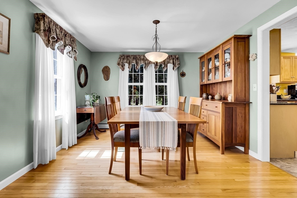 46 A School Street Upton, MA 01568 - Photo 11 of 42 a view of a dining room with furniture window and wooden floor