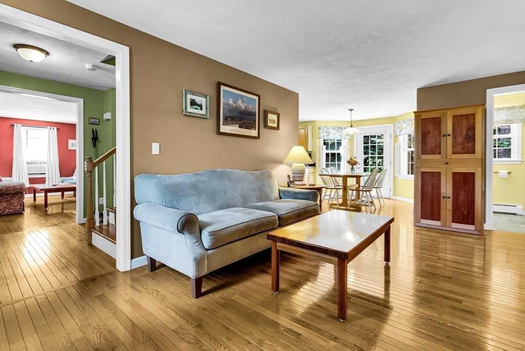 46 A School Street Upton, MA 01568 - Photo 12 of 42 a living room with furniture and a wooden floor