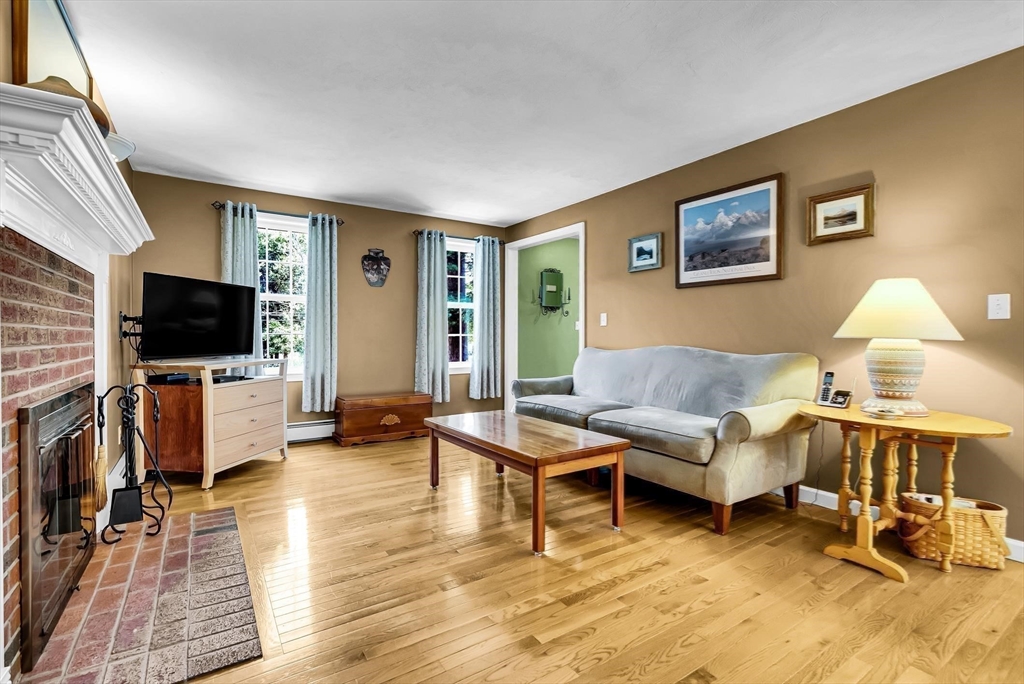 46 A School Street Upton, MA 01568 - Photo 13 of 42 a living room with furniture and a flat screen tv