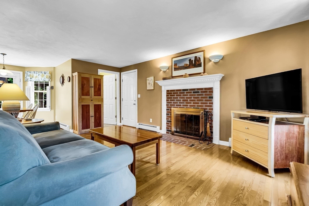 46 A School Street Upton, MA 01568 - Photo 15 of 42 a living room with furniture and a flat screen tv