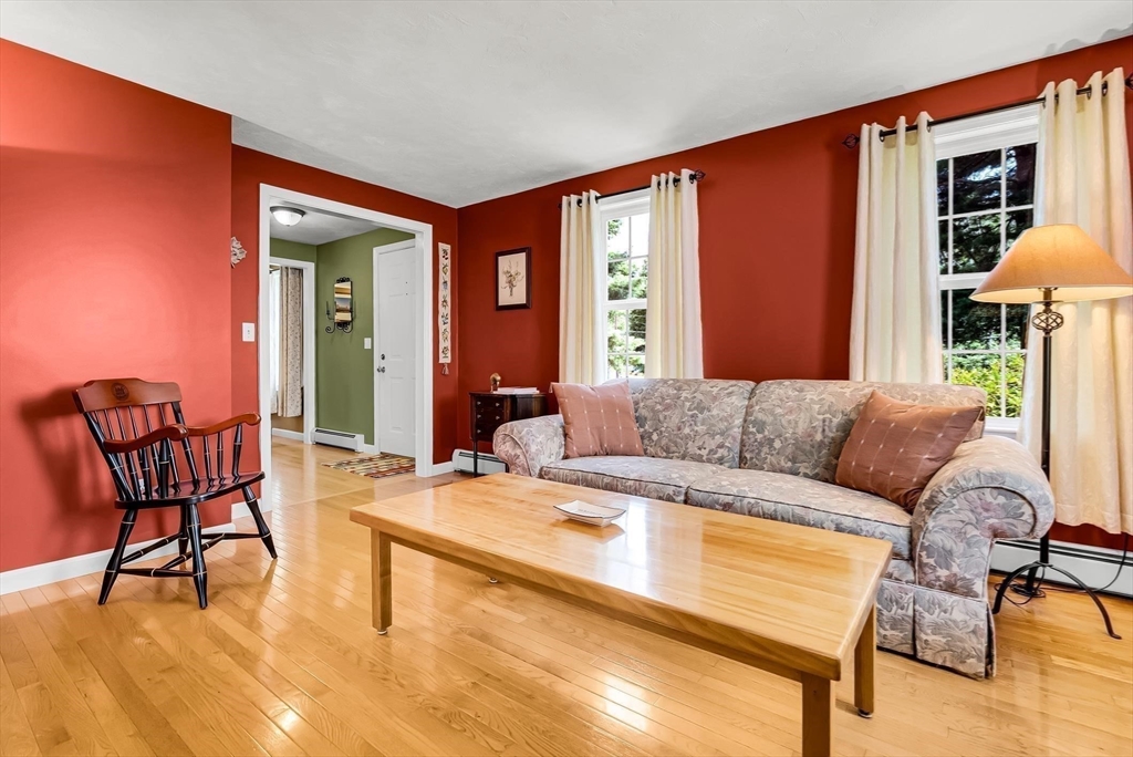 46 A School Street Upton, MA 01568 - Photo 16 of 42 a living room with furniture and a large window