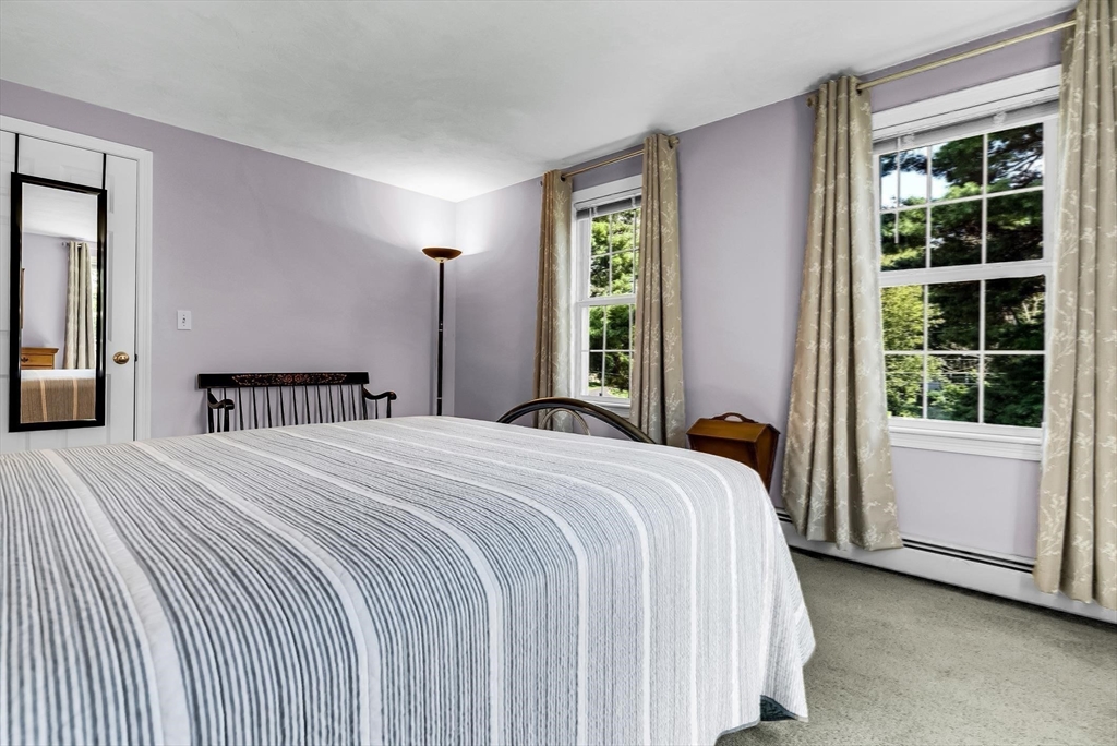 46 A School Street Upton, MA 01568 - Photo 19 of 42 a bedroom with a bed and a large window