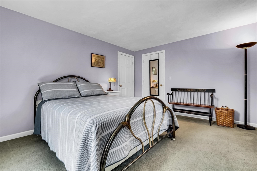 46 A School Street Upton, MA 01568 - Photo 20 of 42 a bedroom with a bed and a window