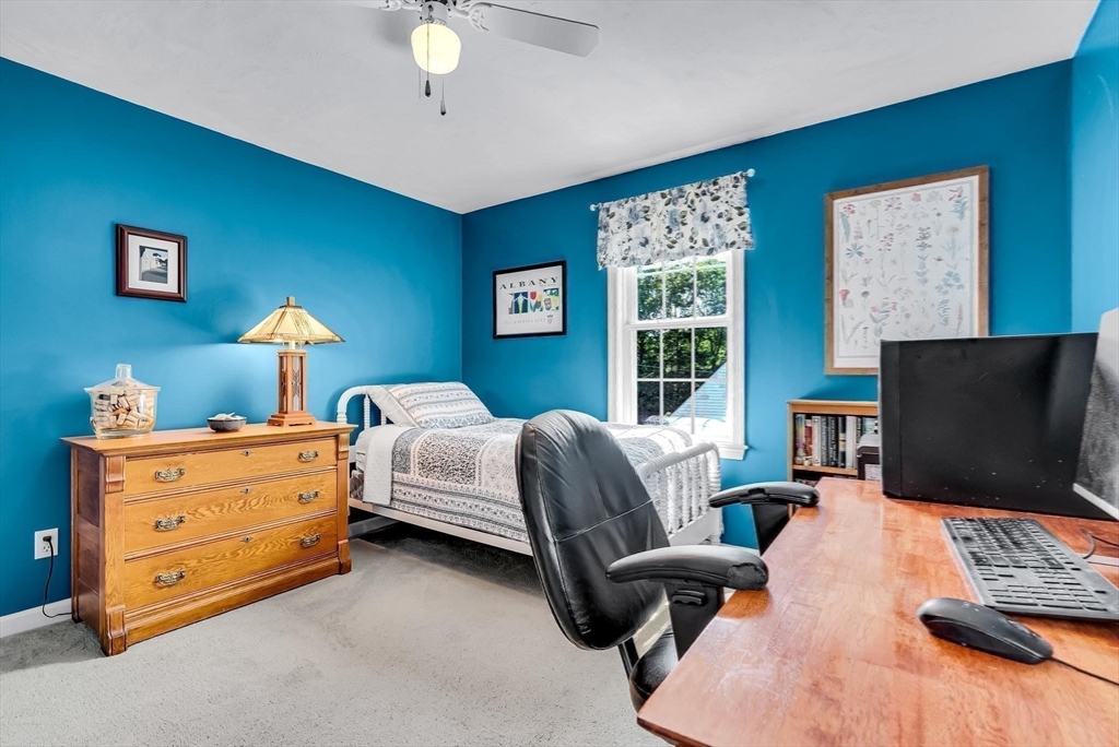 46 A School Street Upton, MA 01568 - Photo 22 of 42 a bedroom with a bed and a flat screen tv