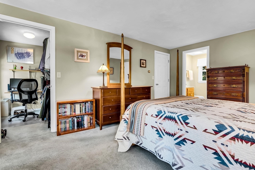 46 A School Street Upton, MA 01568 - Photo 26 of 42 a bedroom with a bed a dresser and book shelf