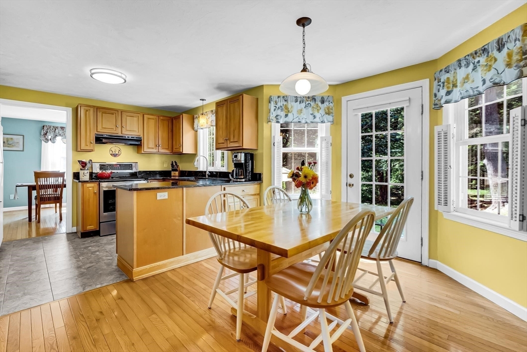 46 A School Street Upton, MA 01568 - Photo 7 of 42 a view of a dining room with furniture and wooden floor