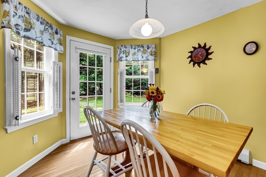 46 A School Street Upton, MA 01568 - Photo 9 of 42 a view of a dining room with furniture window and outside view
