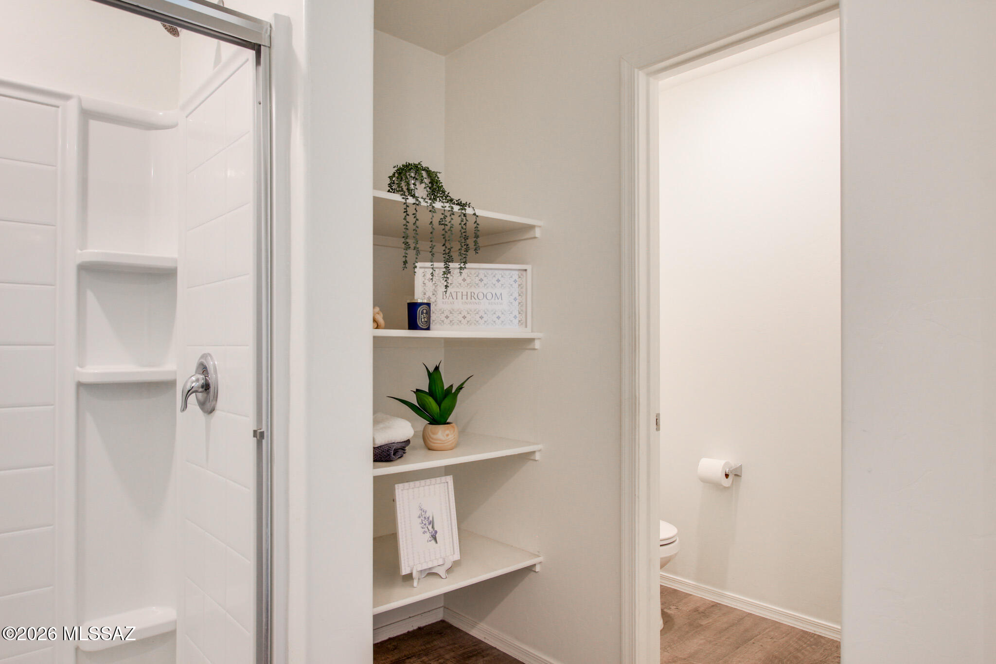 5987 South Antrim Loop Tucson, AZ 85706 - Photo 24 of 34 a view of bathroom with shower and hardwood floor