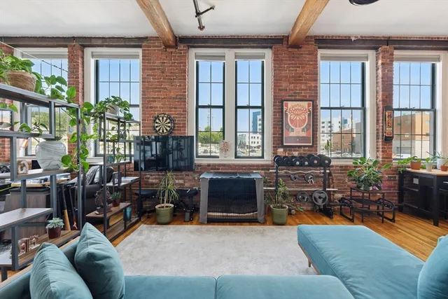 a living room filled with furniture window and a table