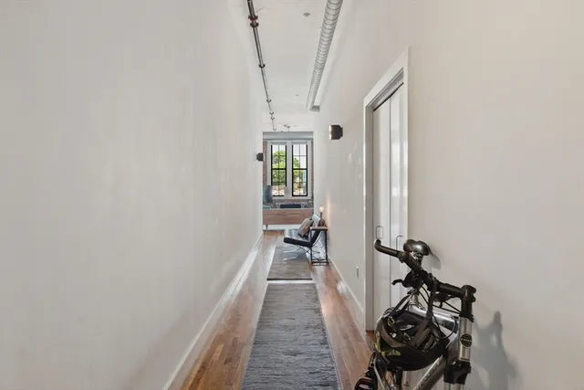 a view of a room with rack on the wall and a window