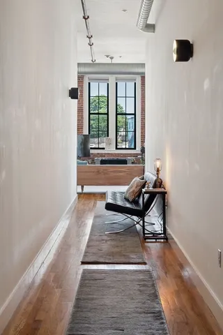 a living room with furniture and a rug