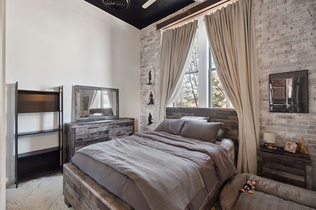 13-17 Willow Street, Unit 206 Lynn, MA 01901 - Photo 36 of 39 a bedroom with a bed and a window