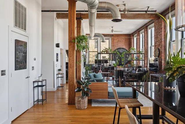 a outdoor space with patio the couches and dinning table with potted plants