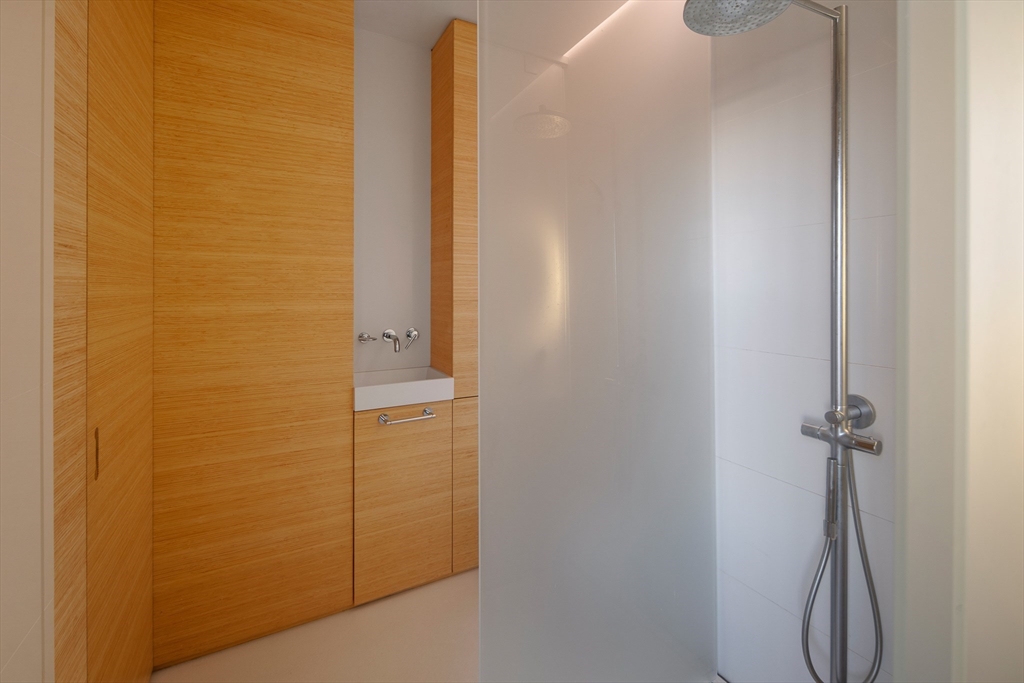 48 Beacon Street, Unit 12F Boston, MA 02108 - Photo 11 of 21 a bathroom with a shower