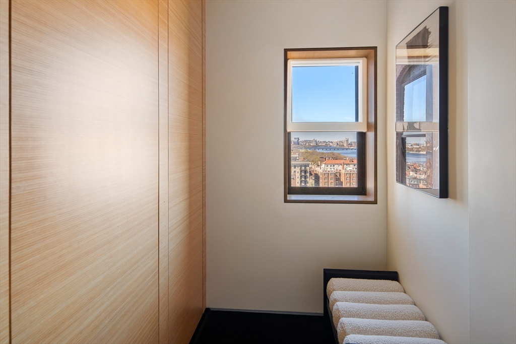 48 Beacon Street, Unit 12F Boston, MA 02108 - Photo 14 of 21 a room with a bed and a window