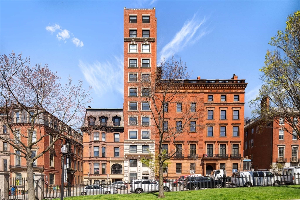 48 Beacon Street, Unit 12F Boston, MA 02108 - Photo 17 of 21 a view of a building with a yard
