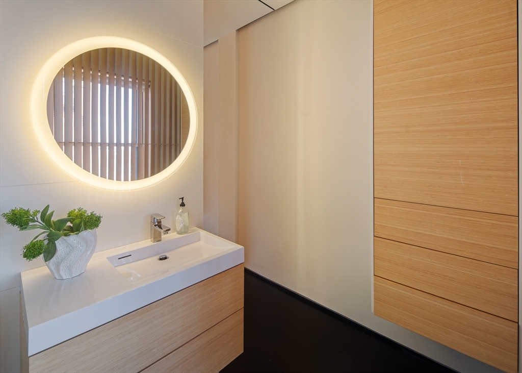 48 Beacon Street, Unit 12F Boston, MA 02108 - Photo 10 of 21 a bathroom with a sink and a mirror