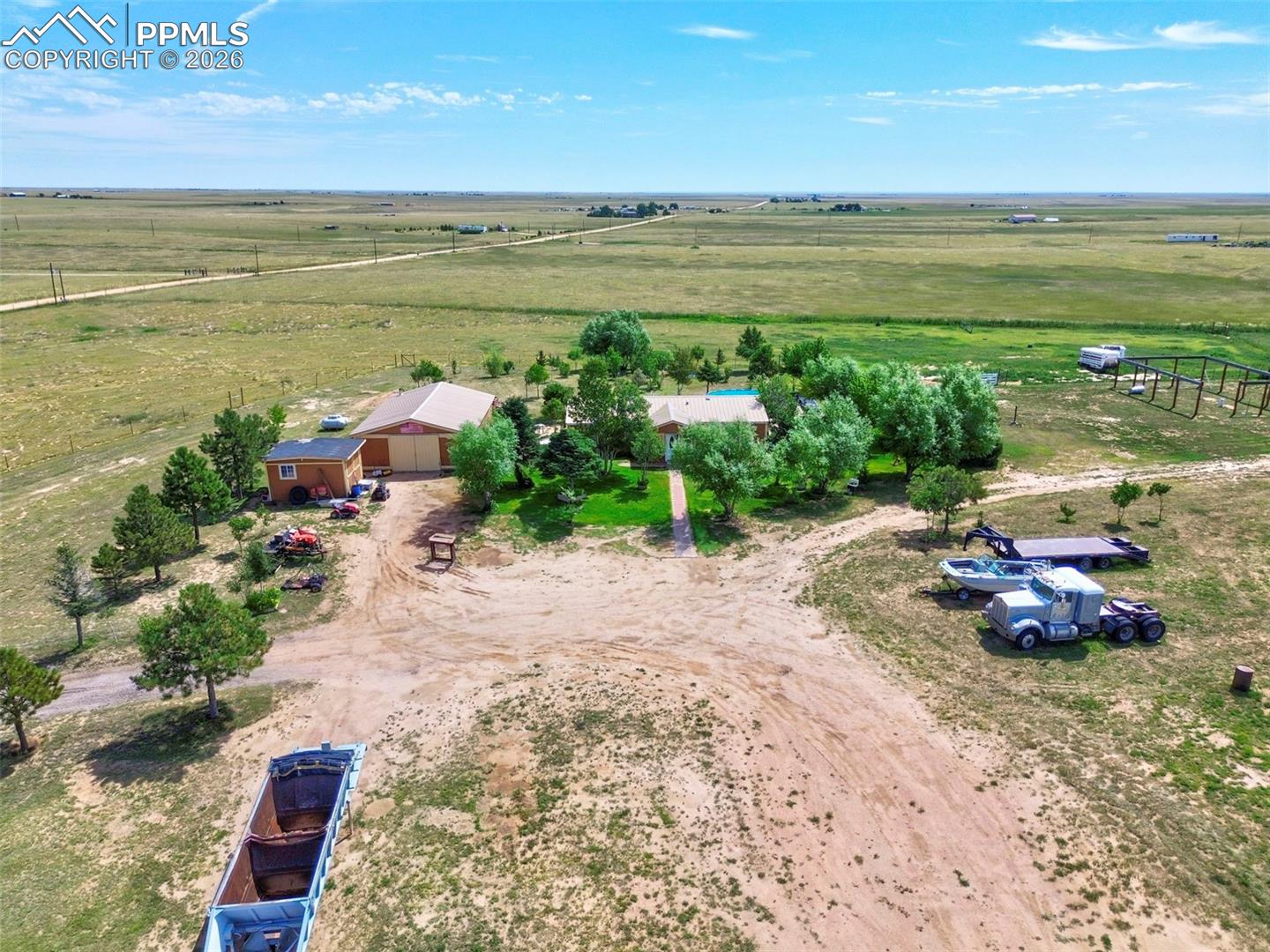35875 Shear Road Yoder, CO 80864 - Photo 5 of 45 Aerial view showing home, tree coverage, and immediate usable acreage