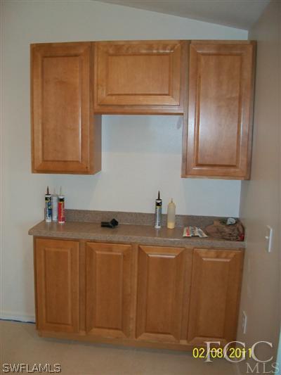 8136 Anhinga Road Fort Myers, FL 33967 - Photo 5 of 6 a bathroom with a sink a toilet and mirror