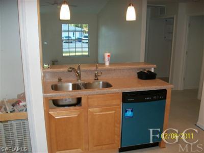 8136 Anhinga Road Fort Myers, FL 33967 - Photo 6 of 6 a kitchen with a refrigerator and a stove