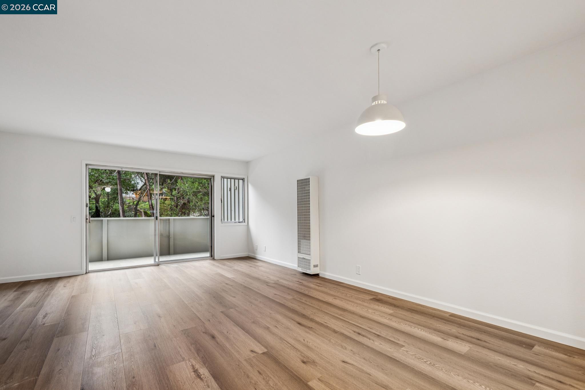 73 Brookwood Road, Unit 11 Orinda, CA 94563 - Photo 2 of 11 a view of wooden floor and windows in a room