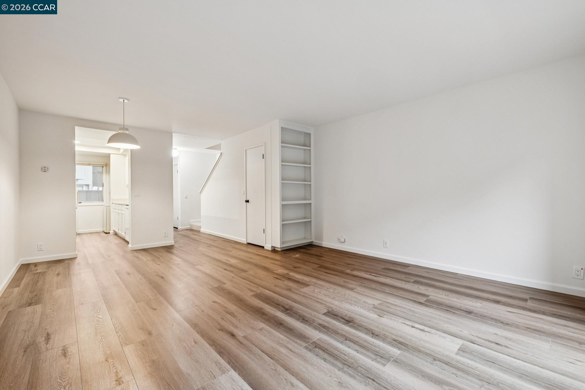 73 Brookwood Road, Unit 11 Orinda, CA 94563 - Photo 3 of 11 a view of an empty room and wooden floor