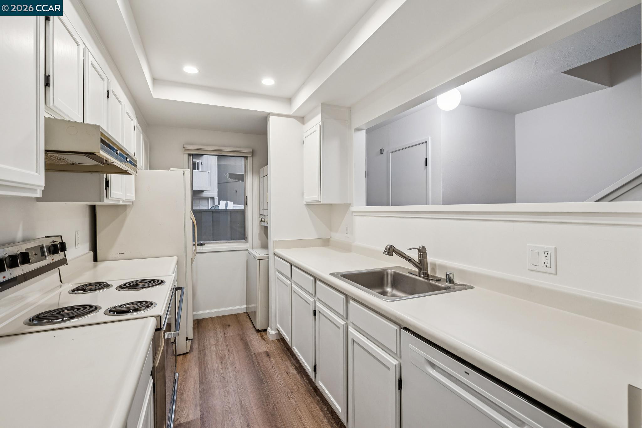73 Brookwood Road, Unit 11 Orinda, CA 94563 - Photo 5 of 11 a kitchen with a sink a stove and cabinets