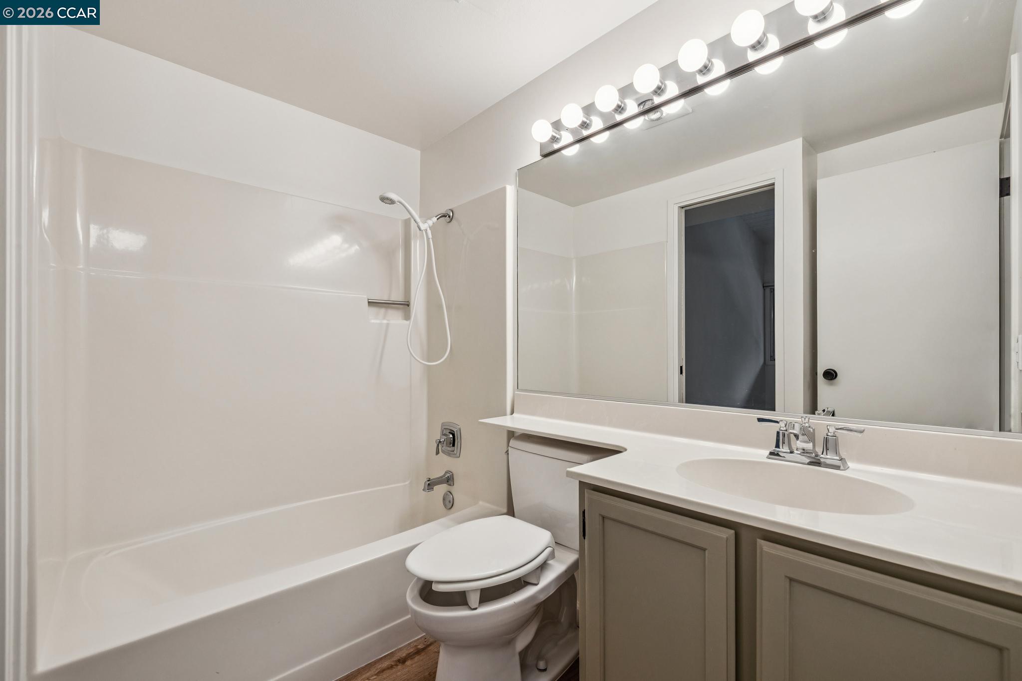 73 Brookwood Road, Unit 11 Orinda, CA 94563 - Photo 8 of 11 a bathroom with a sink toilet tub and shower