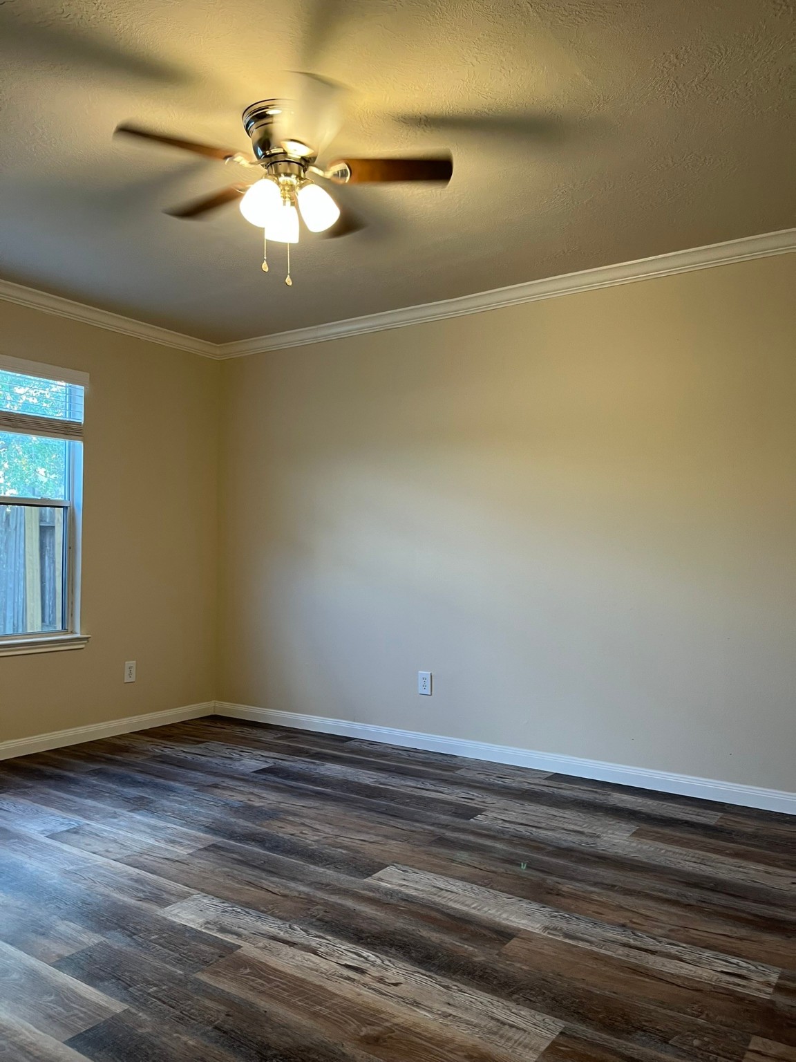21650 Falvel Sunset Court Spring, TX 77388 - Photo 11 of 35 a view of a room with wooden floor and chandelier