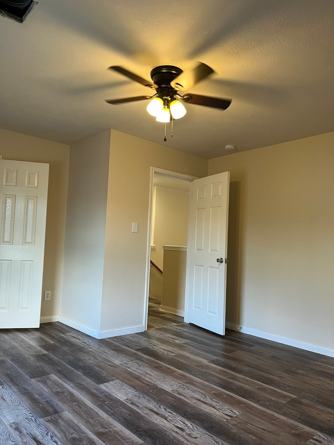 21650 Falvel Sunset Court Spring, TX 77388 - Photo 27 of 35 a view of a livingroom with a chandelier fan and wooden floor