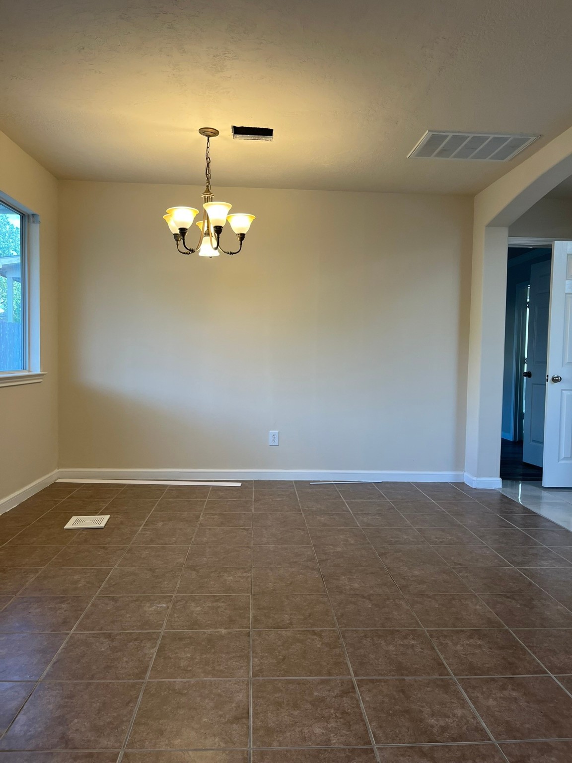 21650 Falvel Sunset Court Spring, TX 77388 - Photo 9 of 35 a view of a room with a chandelier fan and windows