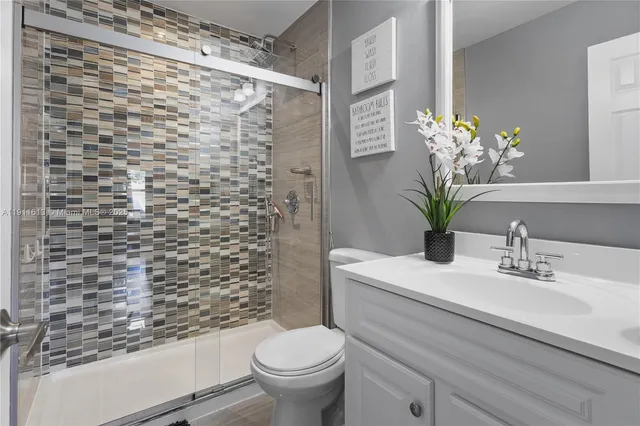 a bedroom with a bed and a flat screen tv in a room