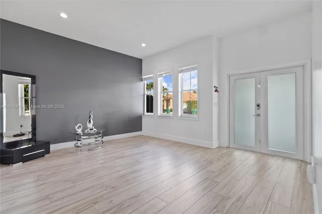 a living room with hard wood floors