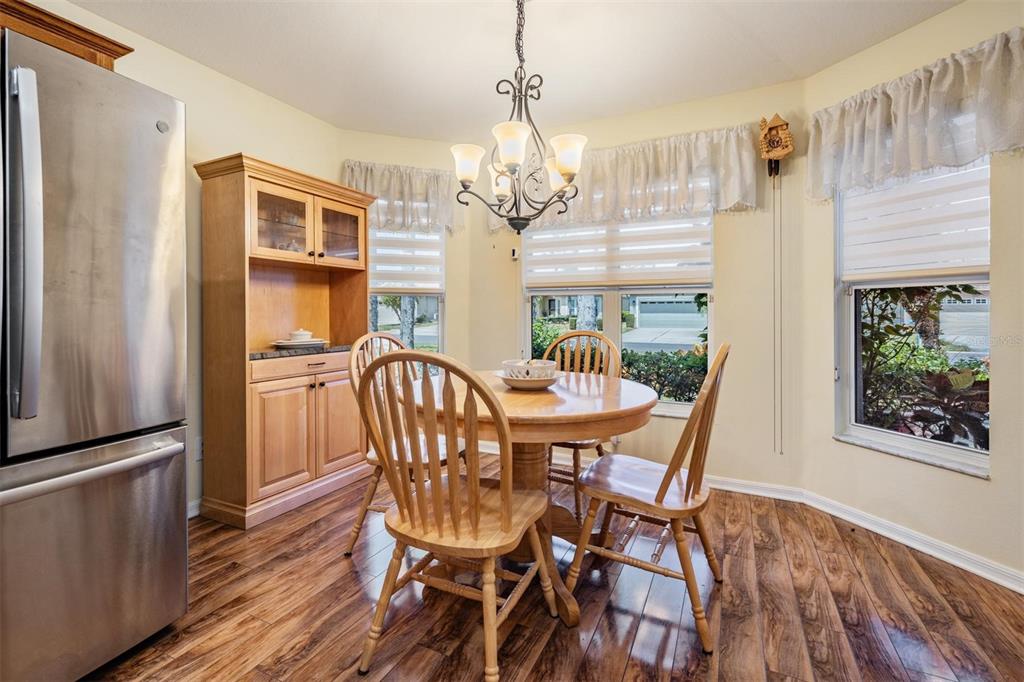 1042 Dustan Place Trinity, FL 34655 - Photo 11 of 48 a view of a dining room with furniture window and wooden floor