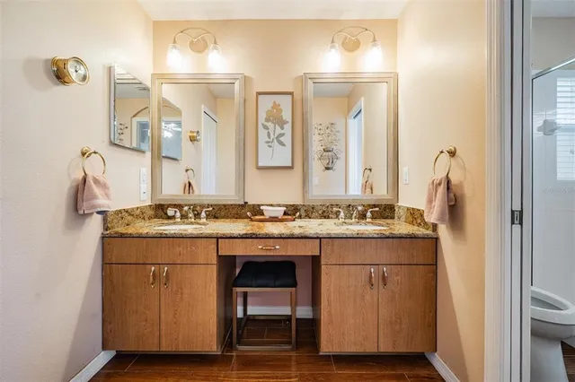 a view of bathroom with dual sinks