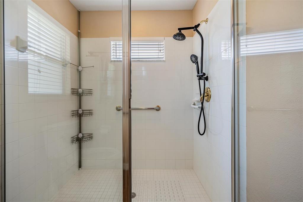 1042 Dustan Place Trinity, FL 34655 - Photo 16 of 48 a bathroom with a shower