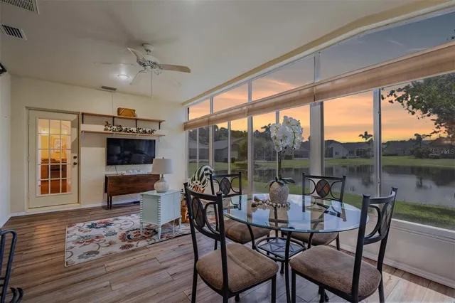 a view of a dining room with furniture window and outside view