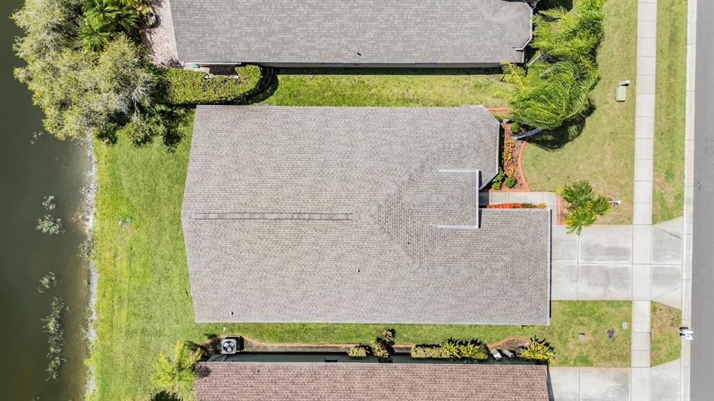 1042 Dustan Place Trinity, FL 34655 - Photo 21 of 48 an aerial view of a house with a yard