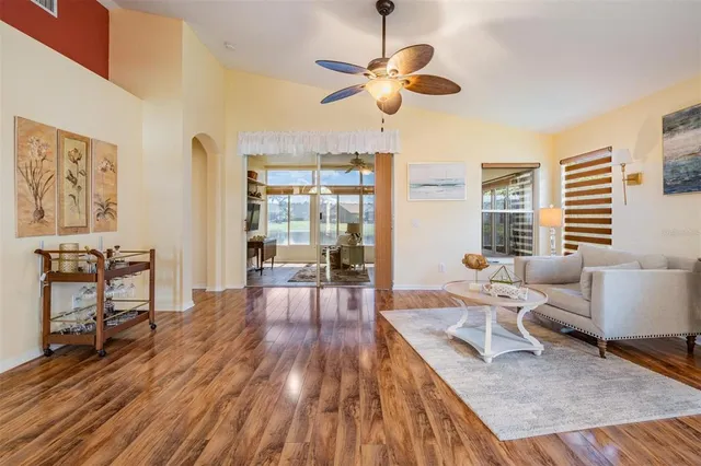 a living room with furniture and a large window