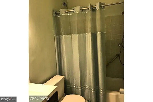 a bathroom with a shower curtain
