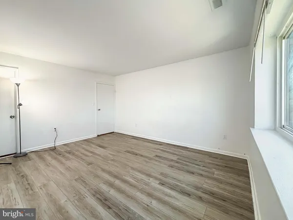 a kitchen with a stove and a white cabinets