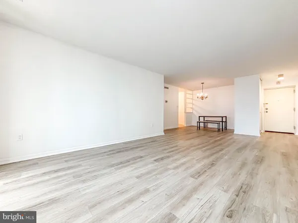 a view of a living room and a wooden floor