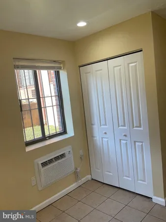 a view of a bathroom with a toilet and a washing machine