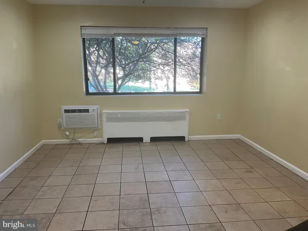 a view of an empty room with a window