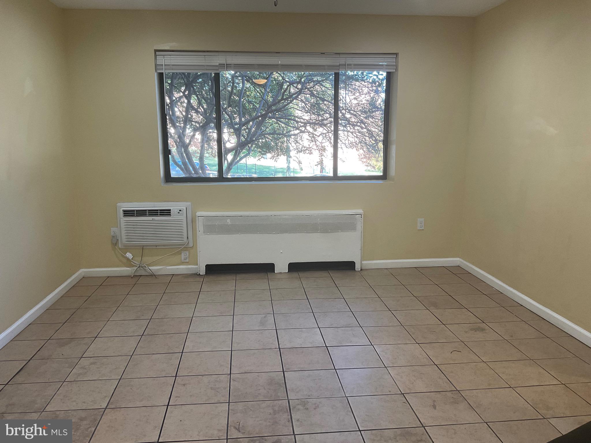 6 Galveston Street Southwest, Unit 103 Washington, DC 20032 - Photo 3 of 17 a view of an empty room with a window