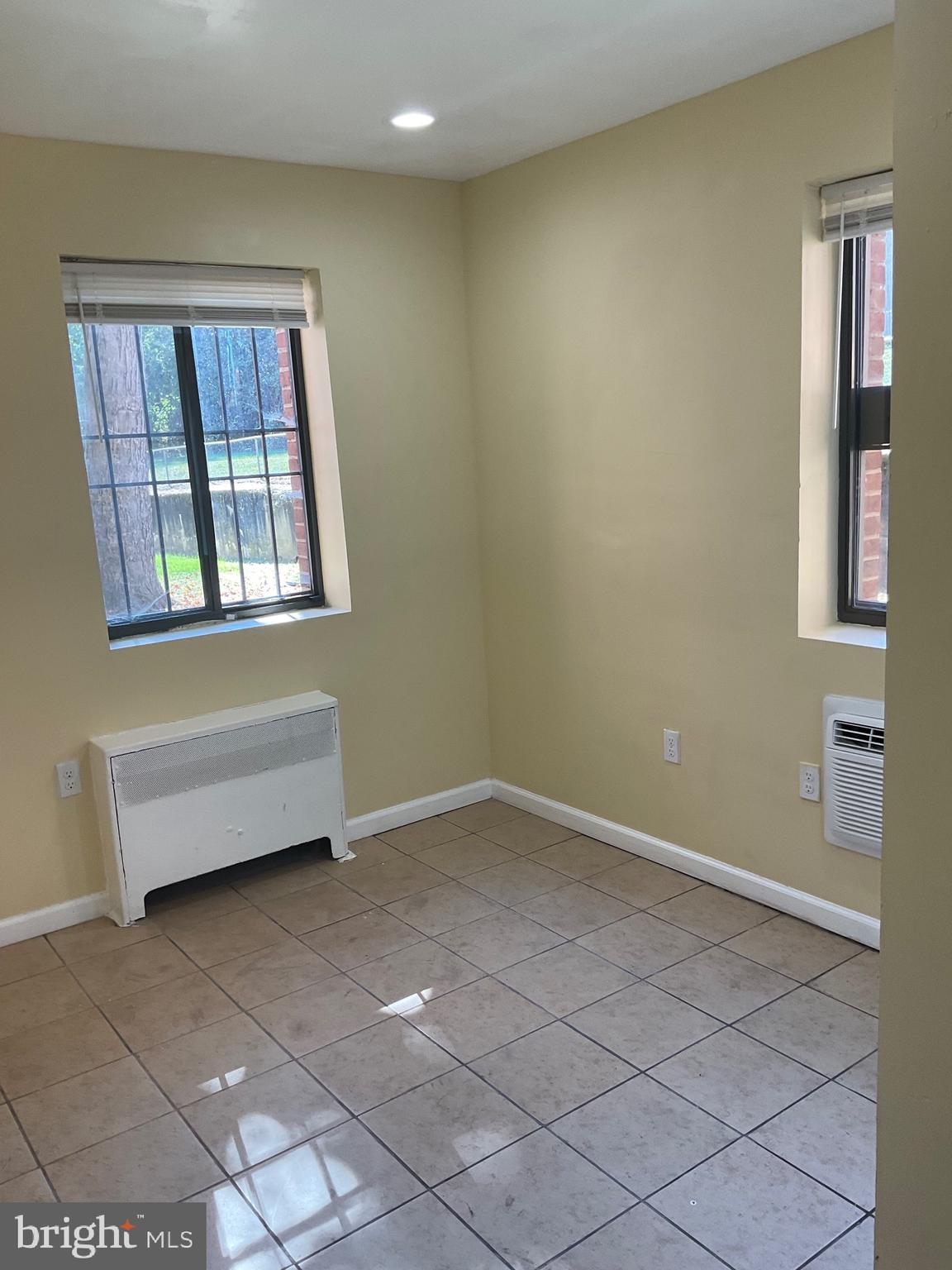 6 Galveston Street Southwest, Unit 103 Washington, DC 20032 - Photo 7 of 17 an empty room with windows